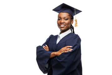 Wall Mural - education, graduation and people concept - happy graduate student woman in mortarboard and bachelor gown