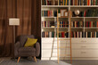 © New Africa - Cozy home library interior with collection of different books on shelves and comfortable place for reading