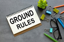 Ground Rule Open Notepad With Text On A Gray Background Multi-colored Stationery.