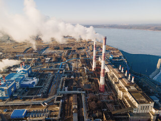 Wall Mural - Industrial factory pollution, smokestack exhaust gases. Industry zone, thick smoke. Climate change and global warming