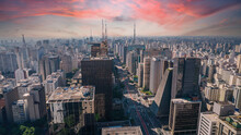 Aerial View Of Av. Paulista In São Paulo, SP. Main Avenue Of The Capital. With Many Radio Antennas, Commercial And Residential Buildings. Aerial View Of The Great City Of São Paulo. Sunset