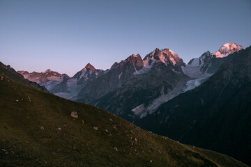 Wall Mural - Mountains of the Greater Caucasus Range at sunset. Elbrus region