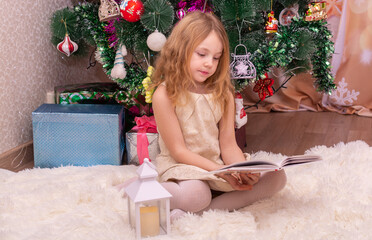 Wall Mural -  A beautiful elegant girl near the Christmas tree in the New Year