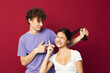 © Tatiana - a guy and a girl next to him holding a pigtail emotions
