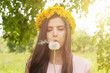 © millaf (Nemchinova) - Spring woman portrait. Young woman blowing on a dandelion