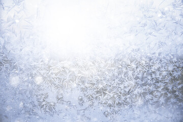 frost patterns on window glass, abstract background winter rime snow