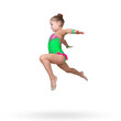 A six-year-old girl in the form of a rhythmic gymnast performs a jumping exercise 