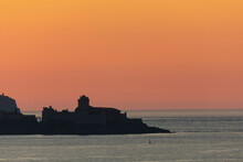 Fort La Latte Near Saint Cast Le Guildo  On Brittany Coast From The Sea Or With Sunset