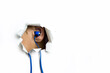 © Igor Bastrakov - Blue headphones in my ear stick out through a hole on a white background.