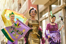 Happy Multi-ethnic People In Mardi Gras Costumes Have Fun On Brazilian Street Carnival.
