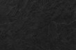 © surasak - Dark grey black slate background or texture. Black granite slabs background.
