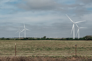 Canvas Print - A beautiful country landscape with windmills against a gloomy sky