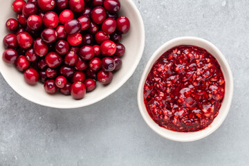 Wall Mural - Red berries on a dark background. cranberries in a bowl.