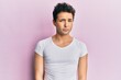 © Krakenimages.com - Young handsome man wearing casual white t shirt skeptic and nervous, frowning upset because of problem. negative person.