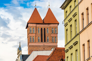 Torun, Poland - August 11, 2021. Two head tower of St. James church - Kosciol pw. sw. Jakuba