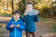 © ADDICTIVE STOCK - Little boys with pieces of ice in forest