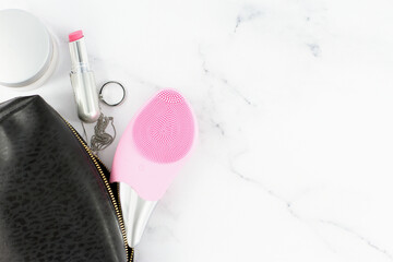 Sonic facial brush with other daily face treatment, lifestyle, copy space