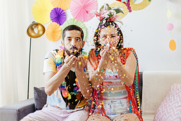 Brazilian Carnival. Couple celebrating carnival at home