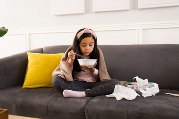 Wall Mural - Sick child enjoying a chicken soup