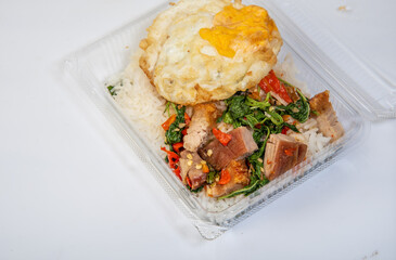 Wall Mural - Crispy pork rice with fried egg, Asian street food, on a white background