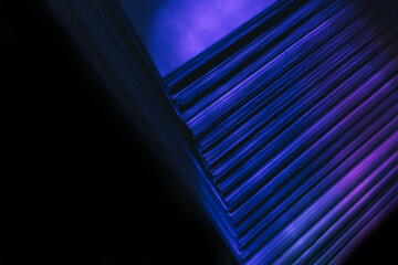 Fototapete - Close up Beautiful book pages in the blue light on a night. Background pattern for design. Macro photography view.