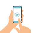 Flat design illustration of a man's hand holding a touch screen mobile phone. On smartphone watching video with play button, vector