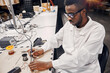 © sata_production - African engineer working manually with tools