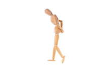Wooden Man Walks Sad With His Hands Behind His Back Isolated On White Background