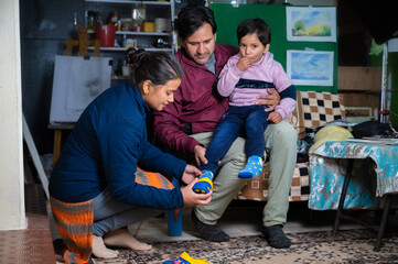 parents force their child to wear shoes .