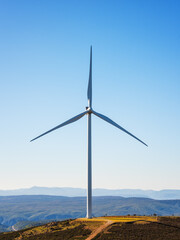Wall Mural - wind turbines on a beautiful blue sky in a mountain wind farm in sardinia. renewable energy concept,