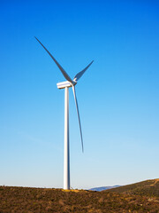 Wall Mural - wind turbines on a beautiful blue sky in a mountain wind farm in sardinia. renewable energy concept,