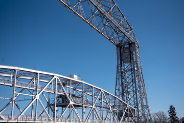 Sticker - An aerial lift bridge against the blue sky