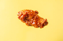 A Piece Of Fried Buffalo Chicken Wing On A Bright Background.