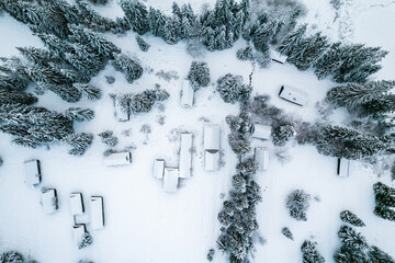 Poster - Wooden Houses in Winter Landscape. Drone View