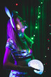© Татьяна - beautiful young woman in new year’s sexy outfit posing with glowing disco ball. New year celebration, party