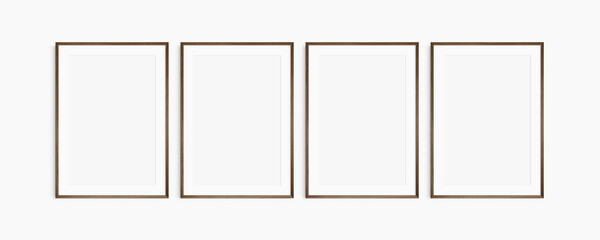 Frame mockup 5x7, 50x70, A4, A3, A2, A1. Set of four thin dark brown walnut wood frames. Gallery wall mockup, set of 4 frames. Clean, modern, minimalist, bright. Portrait. Vertical. Mat opening 2:3.