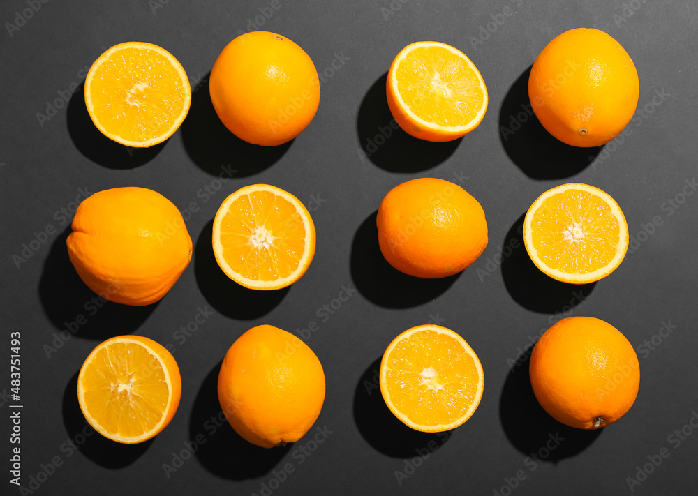 Fresh cut oranges on dark background