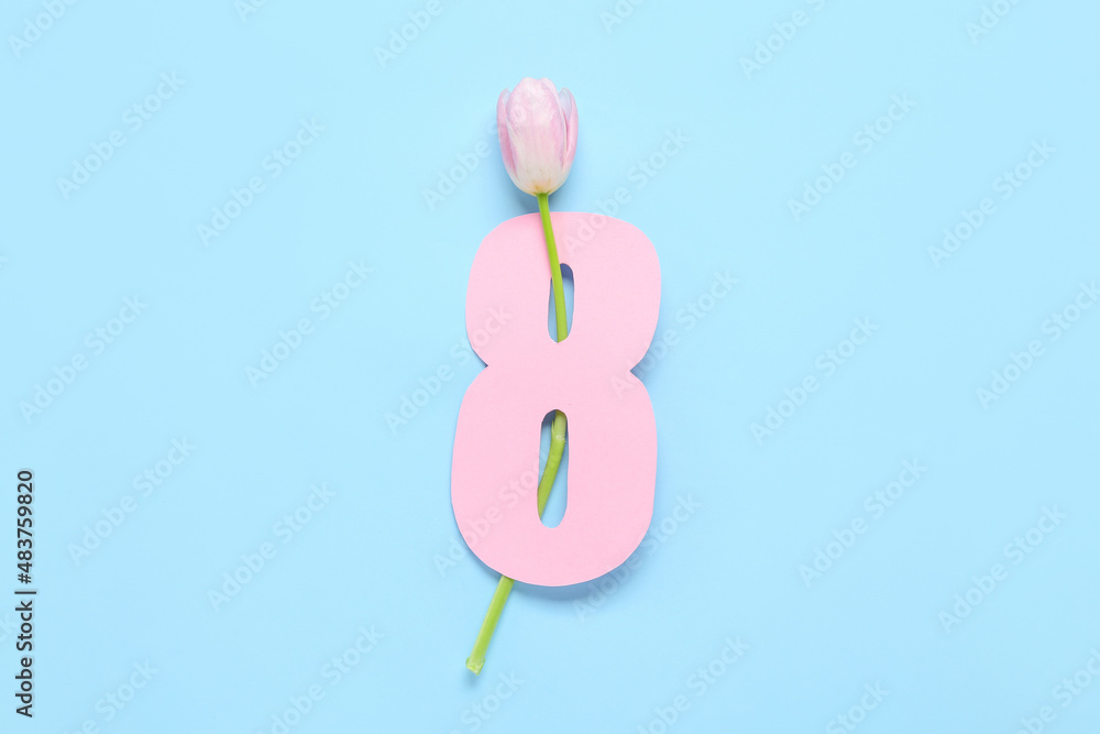 Paper figure 8 and tulip flower on color background