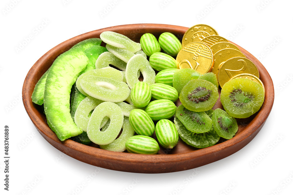 Plate with different sweets for St. Patrick's Day celebration on white background