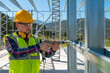 © bulentbaris - The professional young man worker works on installation of a metal frame using drill to screw