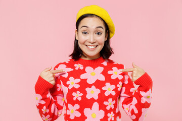 Wall Mural - Surprised amazed woman of Asian ethnicity 20s wear red knitted sweater beret point index finger on herself isolated on plain pastel pink background studio portrait. People lifestyle fashion concept.