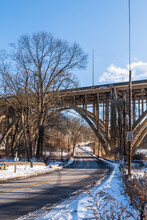 Commercial Street Through Frick Park And Under The Parkway East, State Route 376, Bridge In Pittsburgh, Pennsylvania, USA On A Sunny Winter Day