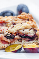 Wall Mural - piece of plum pie with plums around