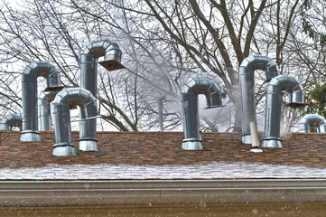 Wall Mural - Ventilation pipes of an air conditioner on a roof top metal system