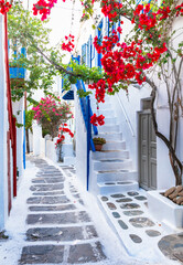 Wall Mural - Charming typical floral streets of greek islands. Mykonos, Cyclades. popular summer tourist destination