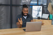© kucherav - Successful African American man takes part in online video conference with colleagues or client. Young man engaged in internet meeting, Video call