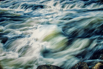 Sticker - A closeup shot of fast flowing river