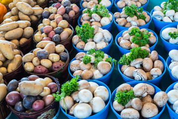 Canvas Print - A closeup of mushrooms and potatoes in a market