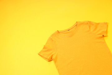 Wall Mural - Orange t-shirt with space for print on yellow background