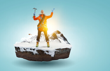 Canvas Print - Mountaineer reaches the top of a snowy mountain